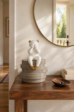 Seated Figure Layered Base Decorative Sculpture