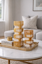 Decorative items on a marble coffee table in a living room setting
