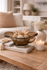 Decorative items on a coffee table in a living room setting