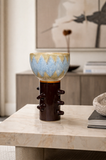 Ceramic vase with textured design on a marble surface
