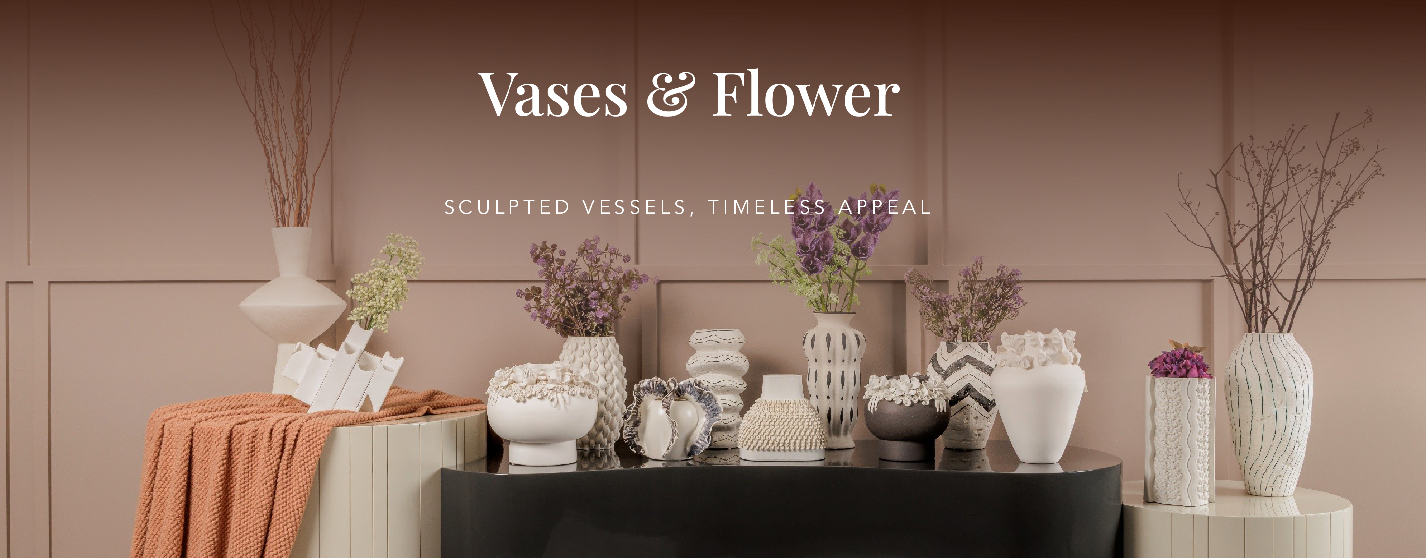 Elegant vases styled with floral décor, adding subtle luxury, organic beauty, and refined decorative detail to interior spaces.