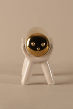 Modern ceramic sculptural decor with beige body and gold electroplated top