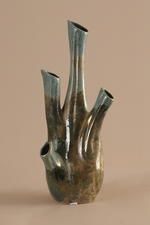 Decorative ceramic vase with unique design on a beige background