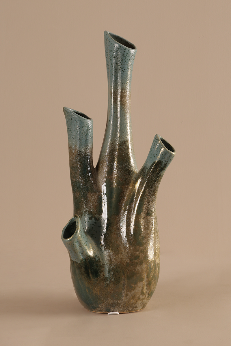 Decorative ceramic vase with unique design on a beige background