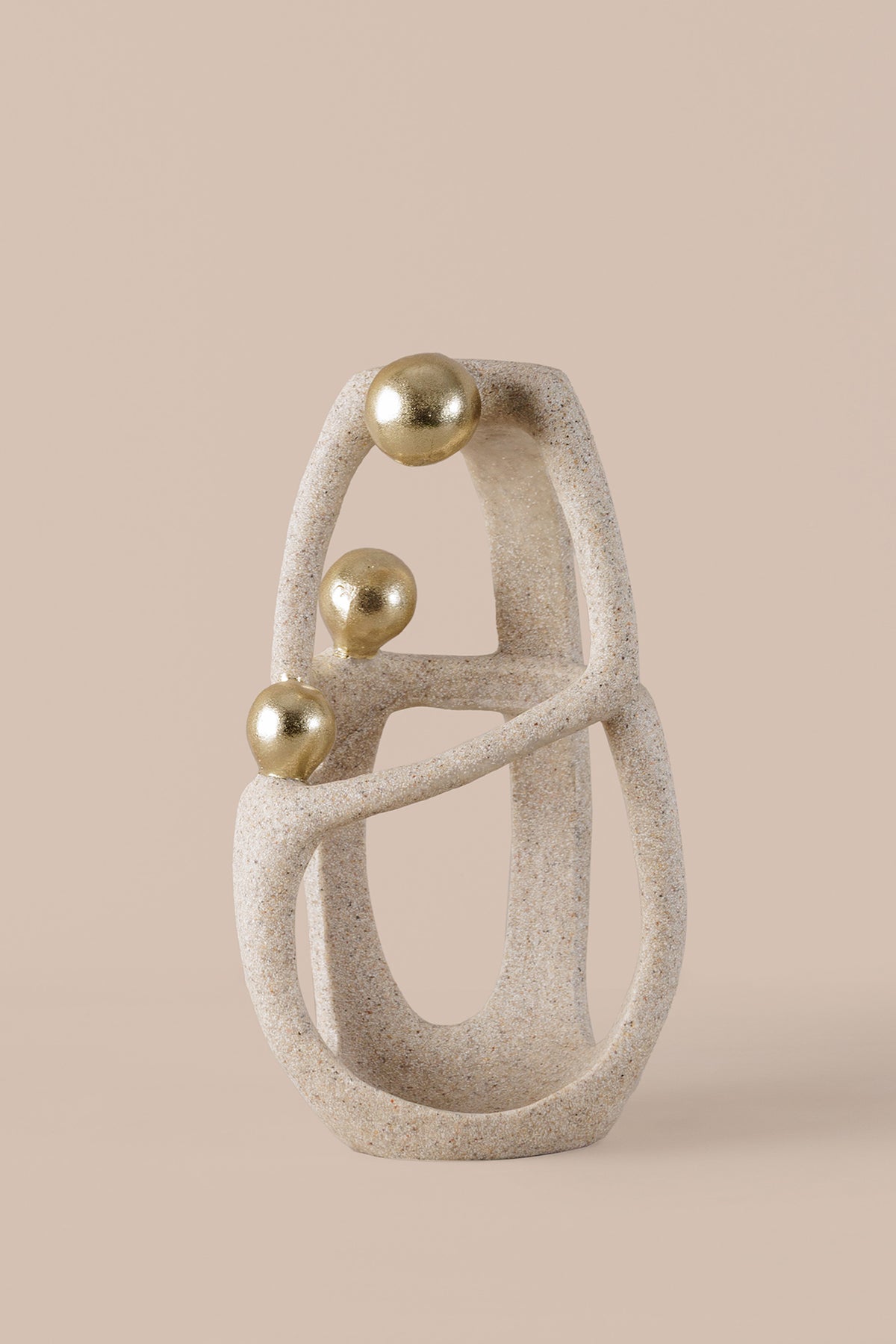Abstract geometric sculpture with textured beige resin gold spheres and crystal accent