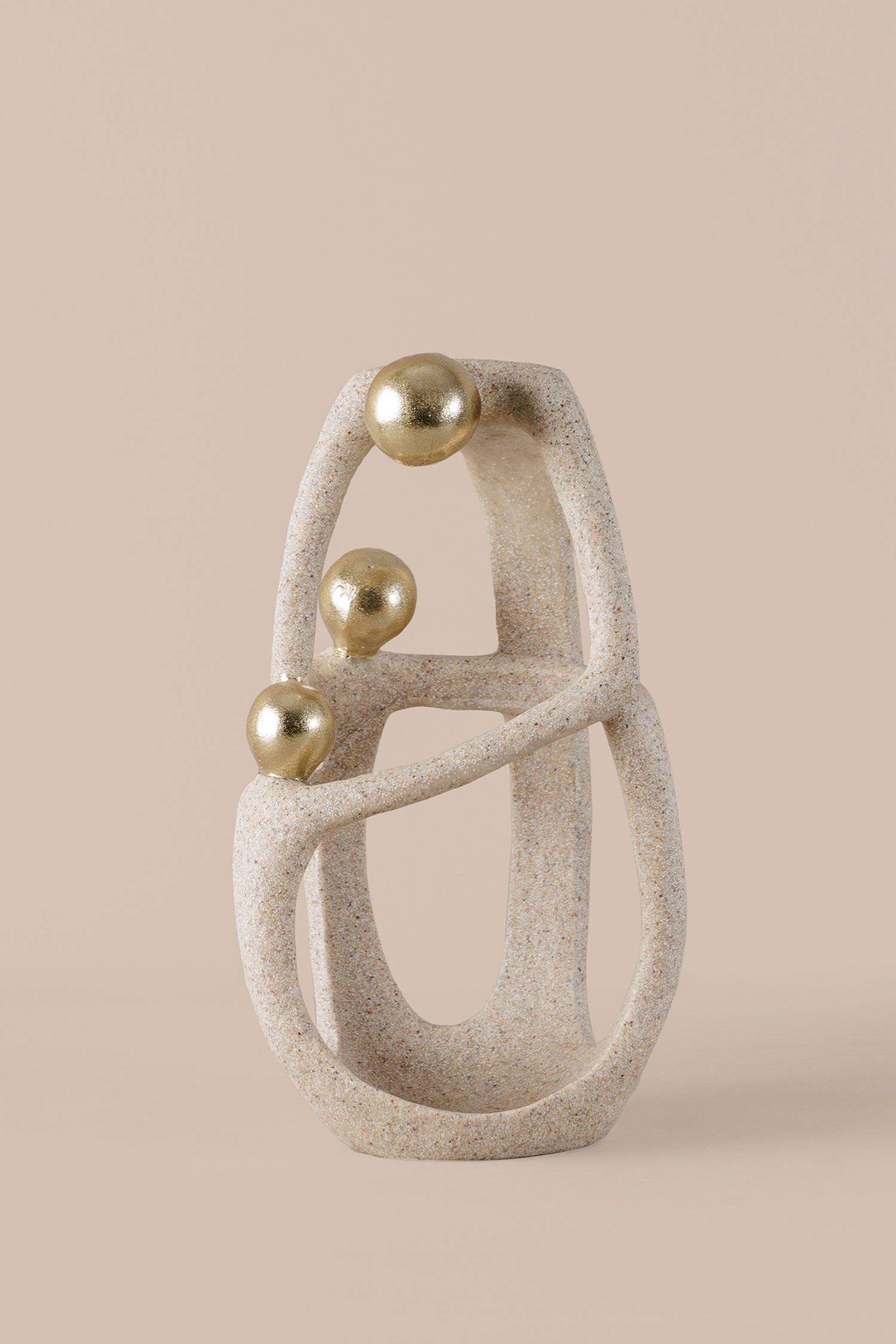 Abstract geometric sculpture with textured beige resin gold spheres and crystal accent