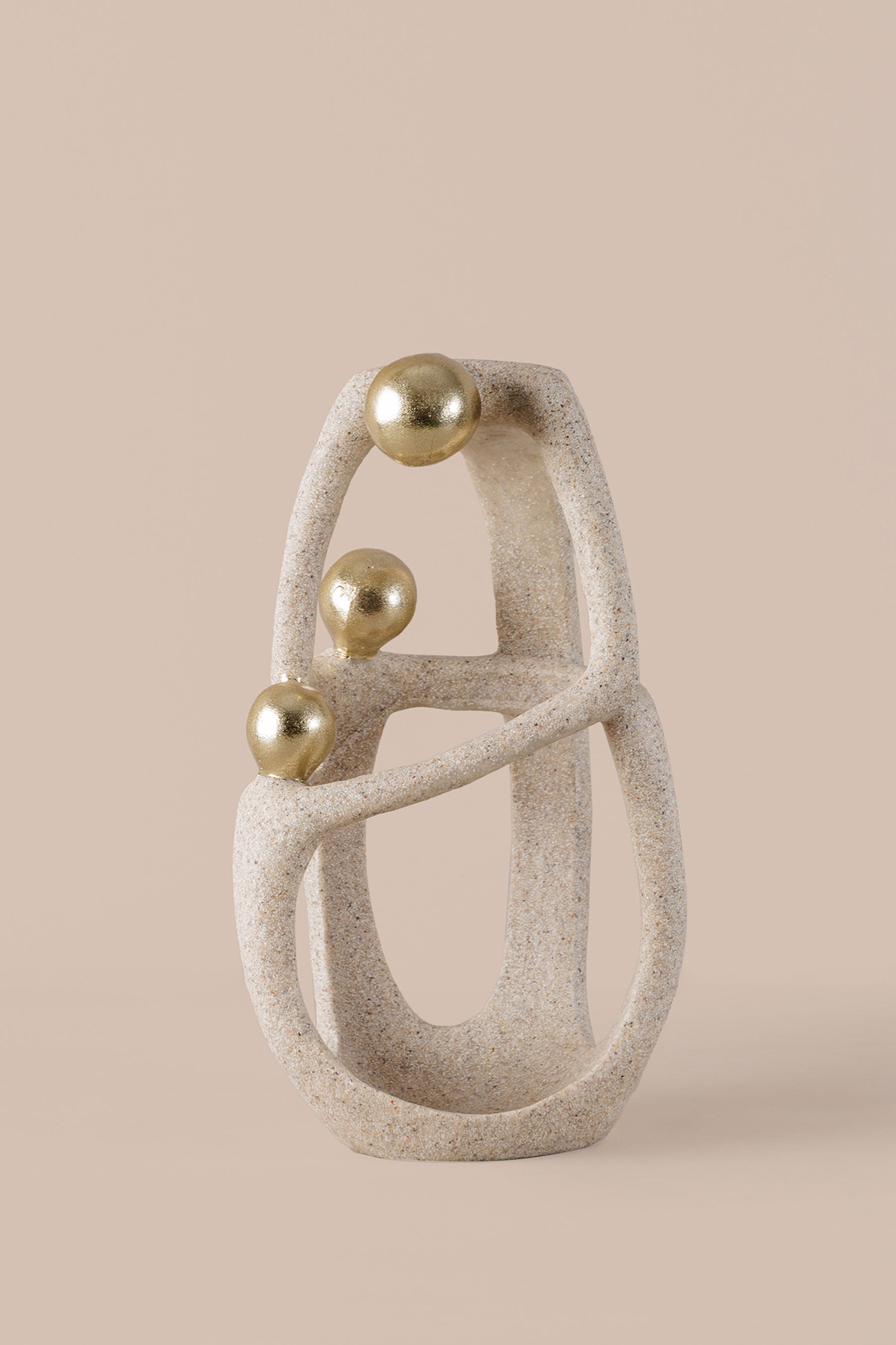 Abstract geometric sculpture with textured beige resin gold spheres and crystal accent
