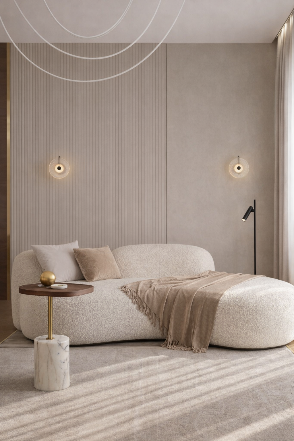 Modern living room with a beige sofa, side table, and decorative elements.