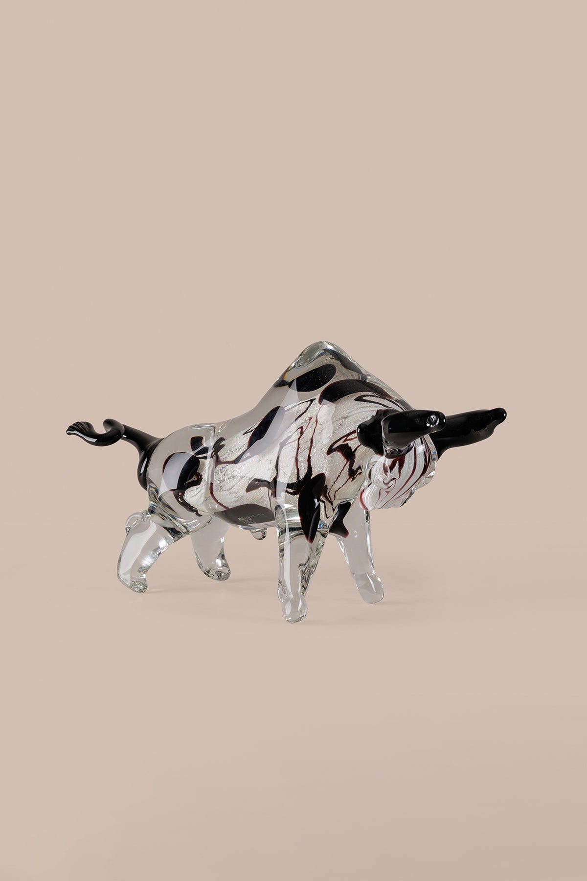 Mirror finish bull sculpture showing polished chrome metallic surface
