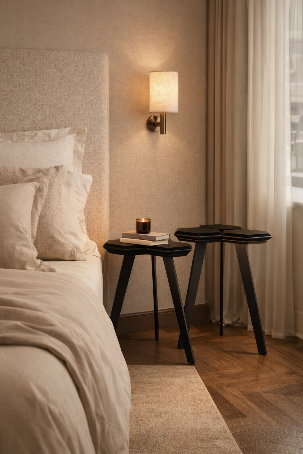 Bedroom with a bed, nightstands, and wall lamp.