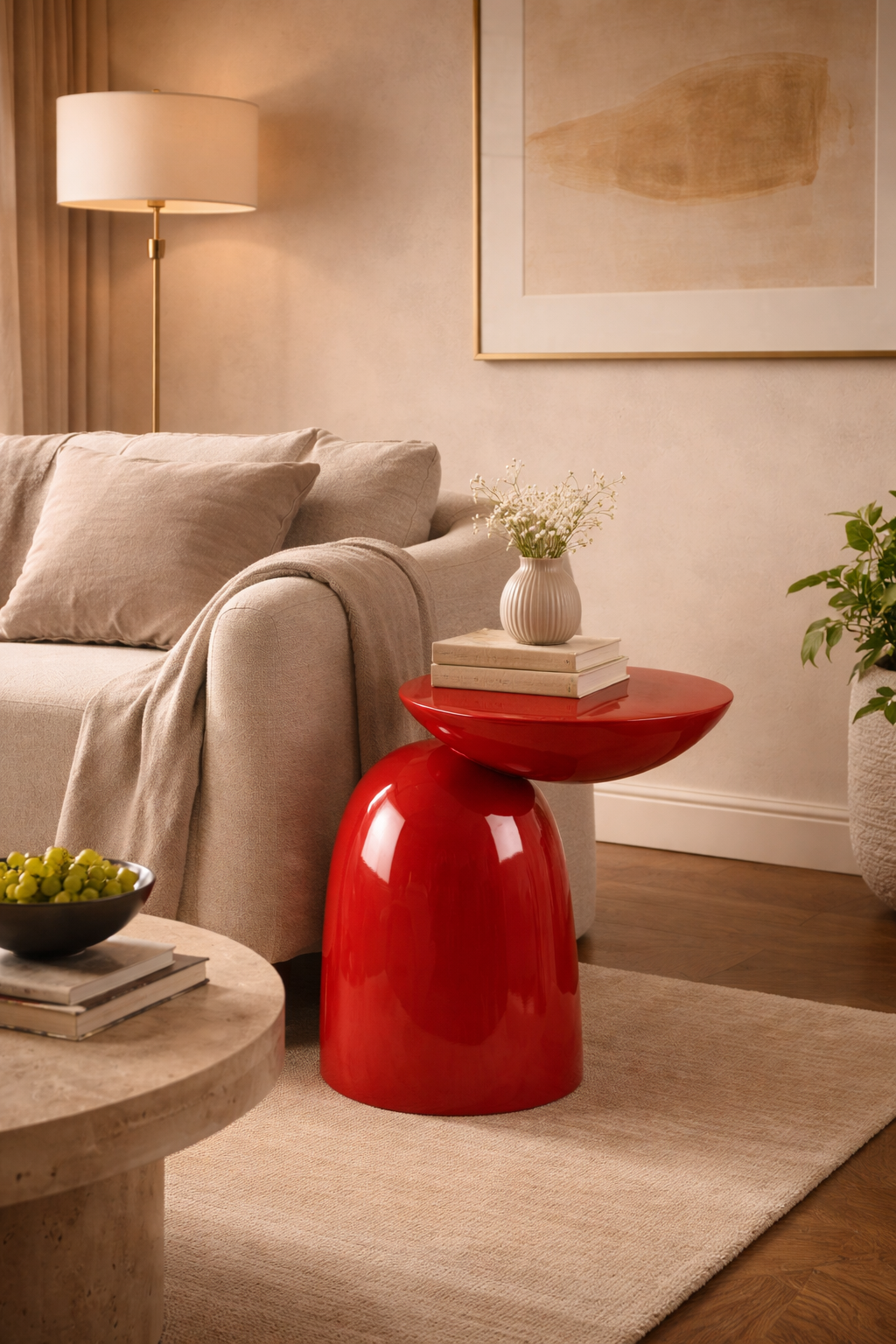 Living room with a red side table, gray sofa, and lamp.