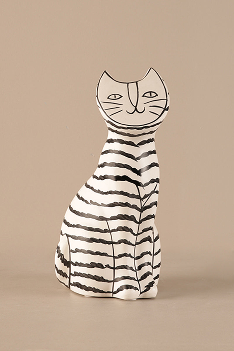 Artisanal ceramic cat sculpture showing hand-drawn stripes and facial details