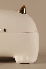White ceramic decorative storage jar with gold detailing