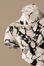 Contemporary torso decor sculpture with white and black marbled finish