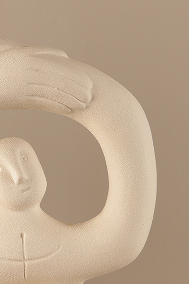 Textured ceramic sculpture showing soft ivory matte surface and sculptural details