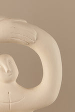 Textured ceramic sculpture showing soft ivory matte surface and sculptural details