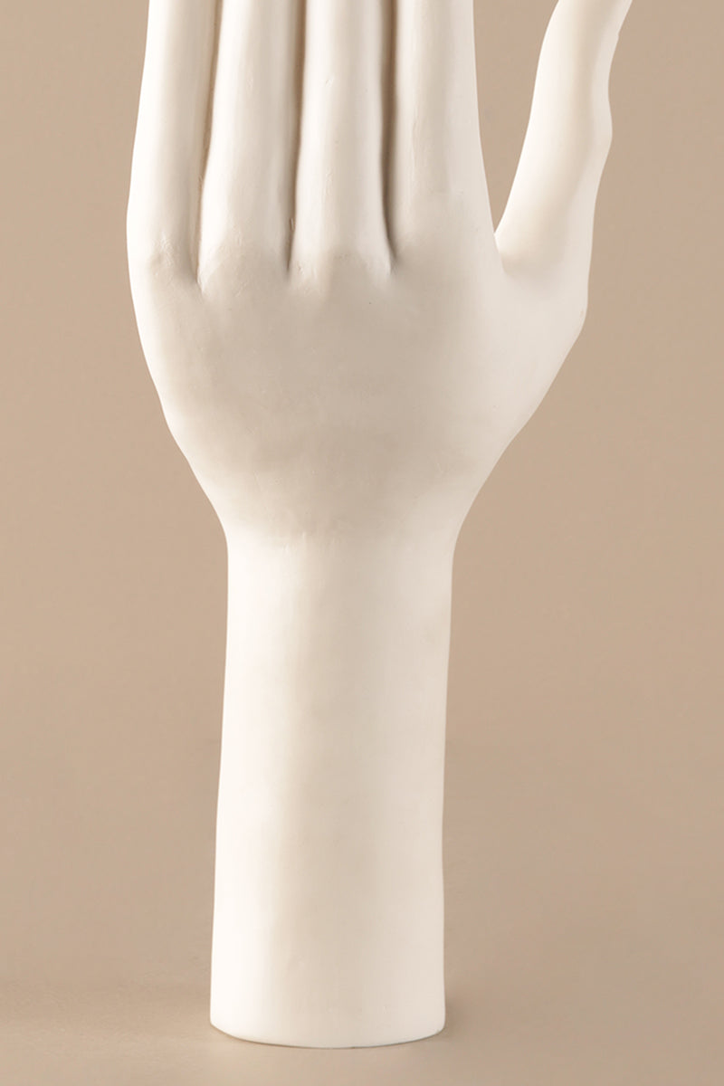 Ceramic hand sculpture showing smooth white glazed surface and refined detailing