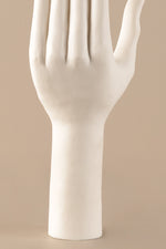 Ceramic hand sculpture showing smooth white glazed surface and refined detailing