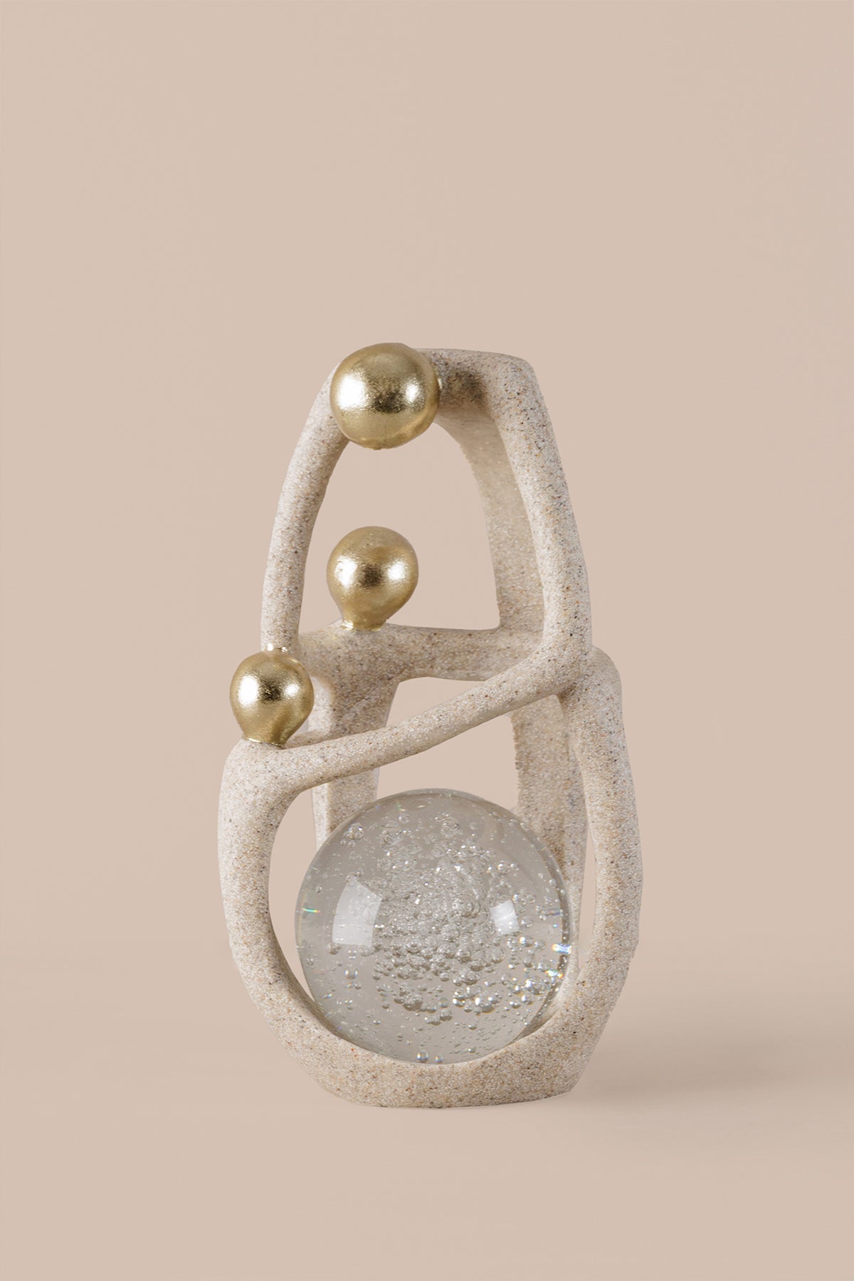 Luxury abstract decor sculpture showing textured resin finish and crystal ball