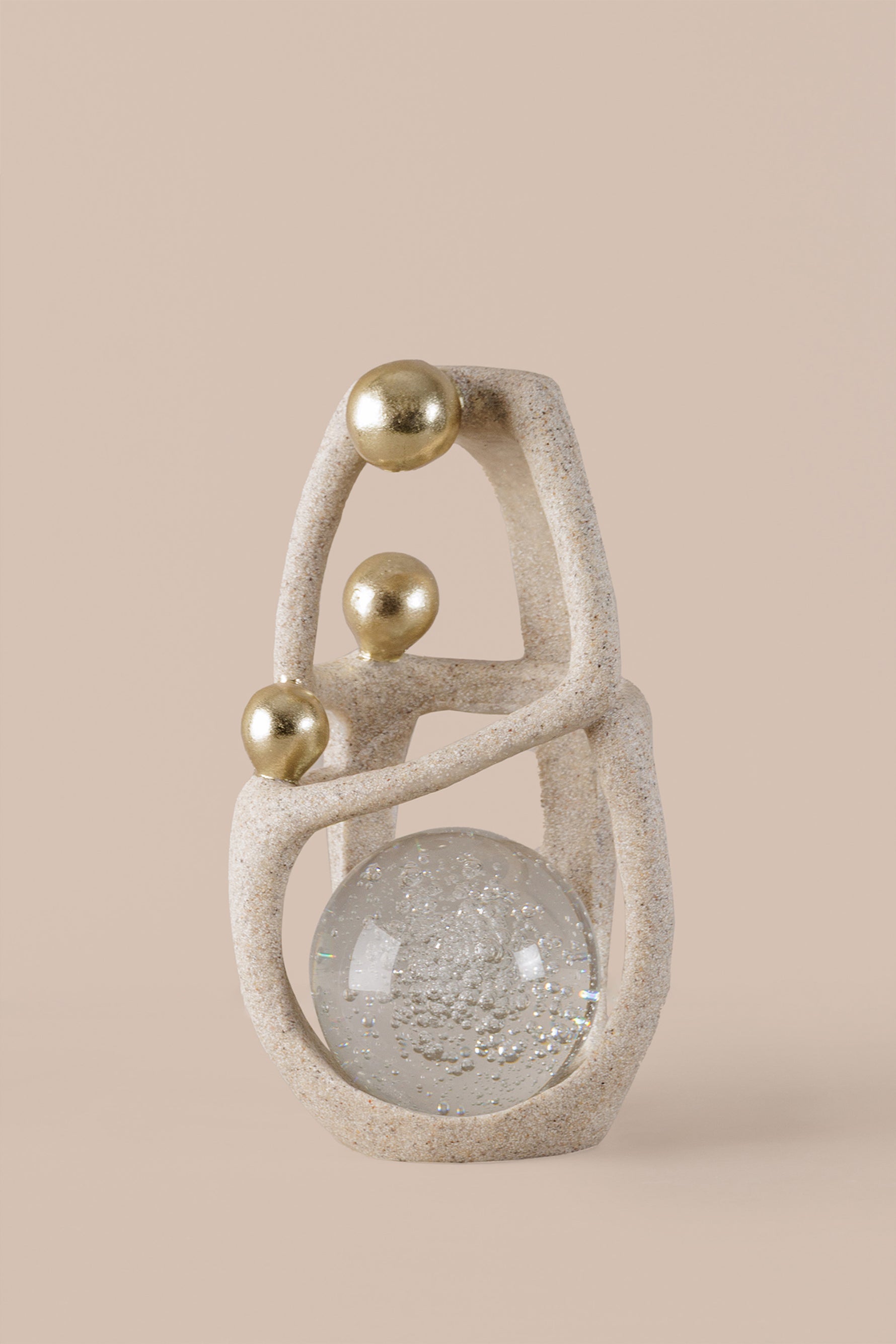 Luxury abstract decor sculpture showing textured resin finish and crystal ball