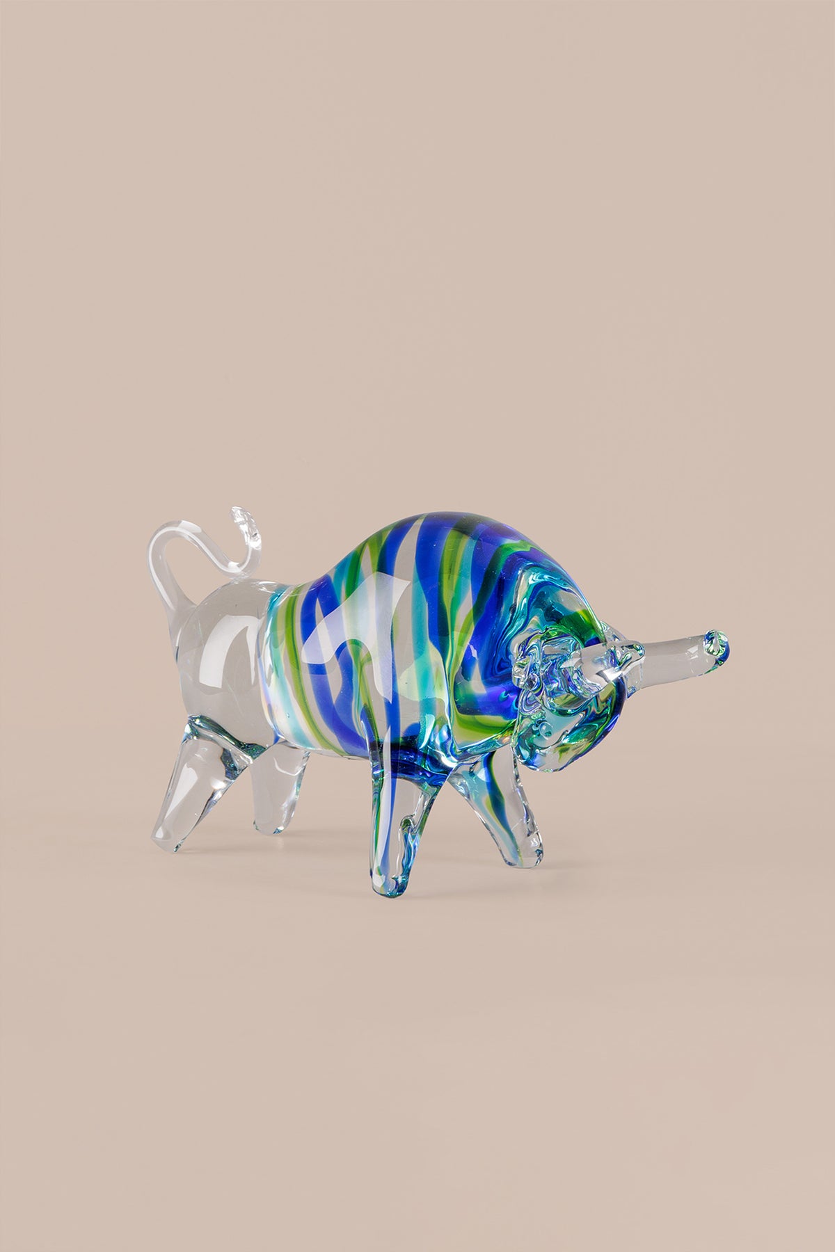 Murano inspired glass bull decor showing layered blue green glass detailing