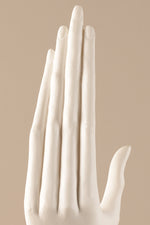 Modern ceramic hand decor sculpture displayed as contemporary interior accent