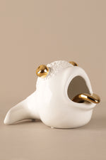 Luxury ceramic ashtray showing smooth white glaze and gold detailing
