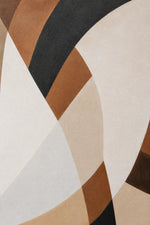 Abstract geometric pattern rug with curved sweeping shapes in cream, beige, tan, brown, black, and off-white.
