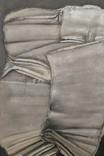 An abstract painting depicting draped, folded gray and beige fabric textures with expressive brushstrokes on a dark background.