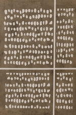 An abstract art print or textile featuring a grid layout with white irregular painted dots on a textured taupe-brown background.