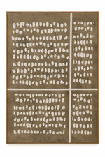 A framed abstract geometric wall art piece featuring a brown background with white dotted patterns arranged in four quadrants and divided by white grid lines, set in a thin light wood frame.