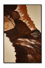 An abstract canvas painting featuring textured, layered brushstrokes in earthy brown, terracotta, beige, and black, framed in a thin black border against a white background.