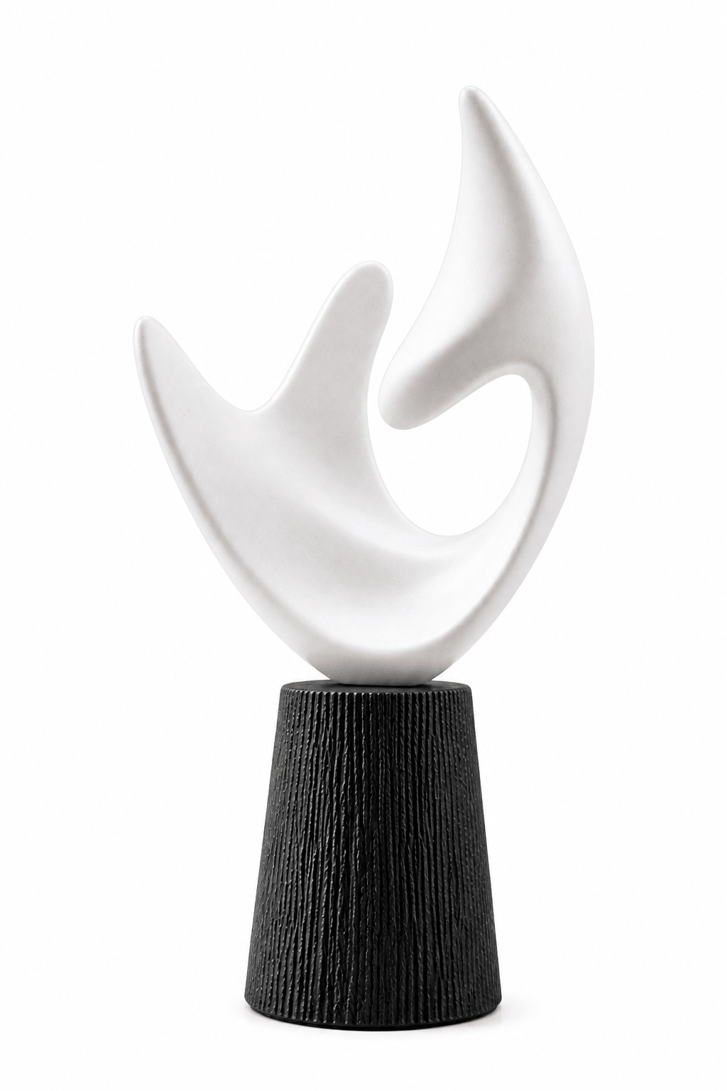 An abstract sculptural tabletop piece featuring a smooth white curved form mounted on a textured black cylindrical base, photographed against a plain white background.