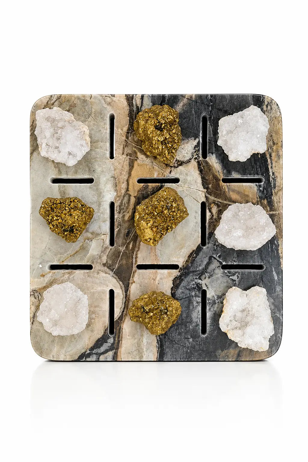 A square decorative tray or coaster with a black, gray, and beige marble pattern, featuring nine cutouts and set with nine natural mineral and crystal specimens. The crystals include white quartz-like formations and four metallic gold-colored specimens, all displayed on a clean white background.