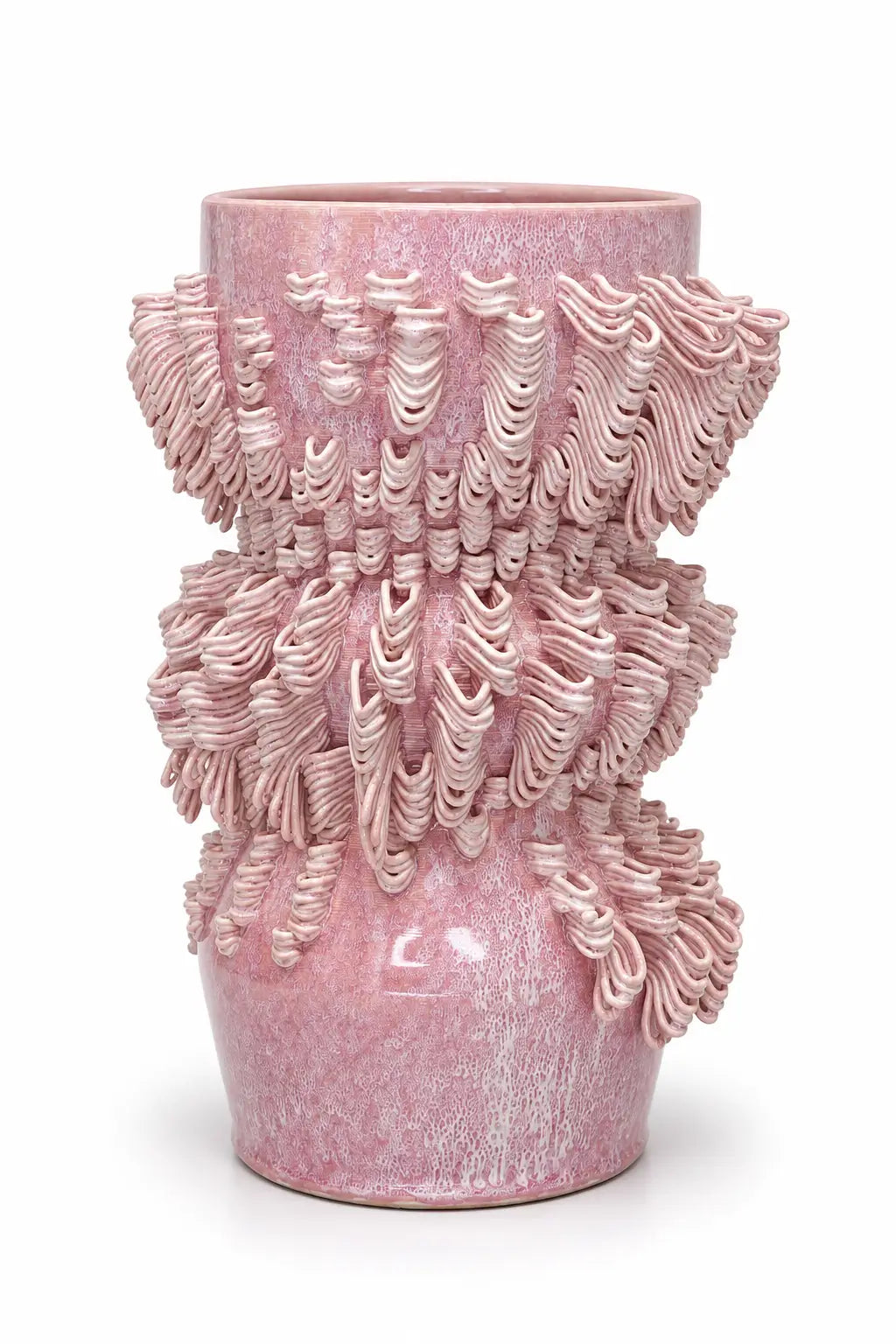 A pink textured ceramic vase with a flared rim and intricate, sculpted ridges, shown on a plain white background.