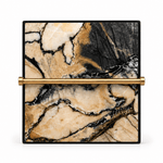 A square decorative box with a black frame and a gold horizontal bar handle, featuring a beige and black marble pattern on the front, set against a plain white background.