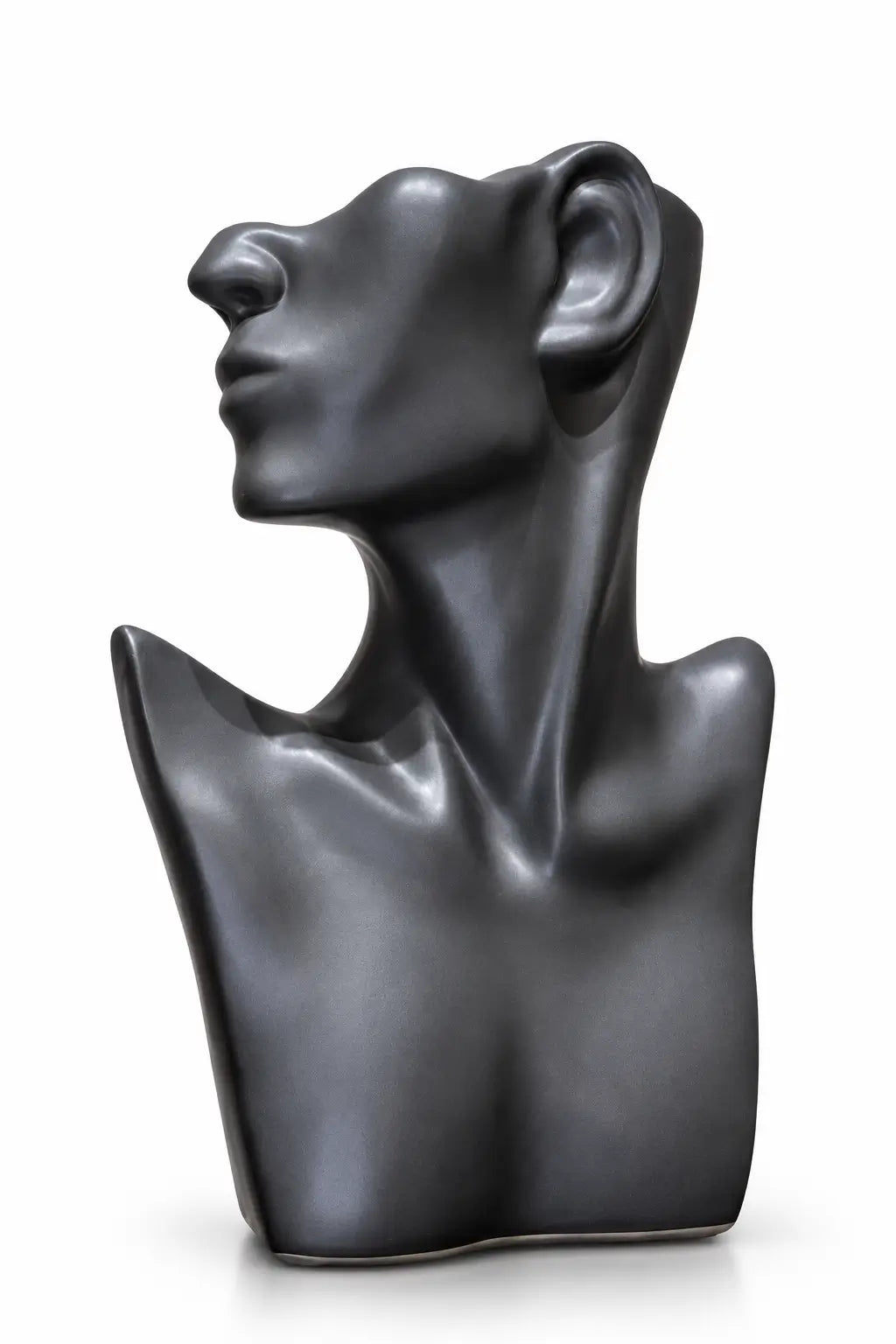 A dark charcoal gray ceramic sculpture of a stylized female bust in profile, shown on a clean white background.