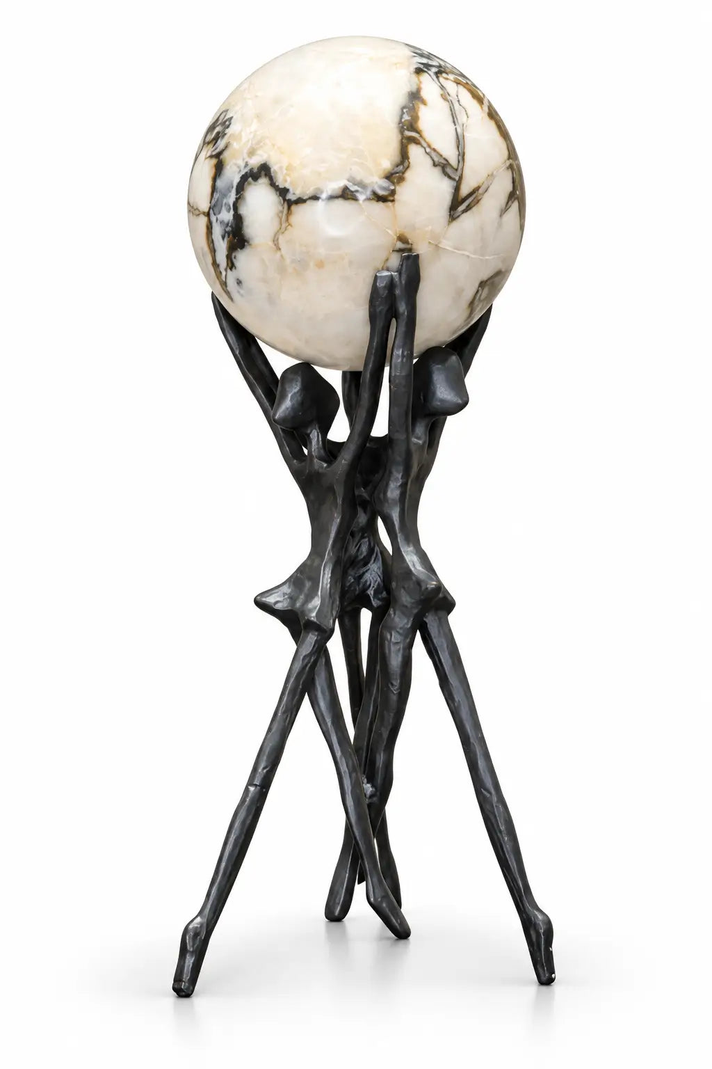 A decorative sculpture featuring a large spherical stone orb with cream, beige, and black marbled patterns, supported by a dark, abstract metal tripod stand shaped like stylized figures.