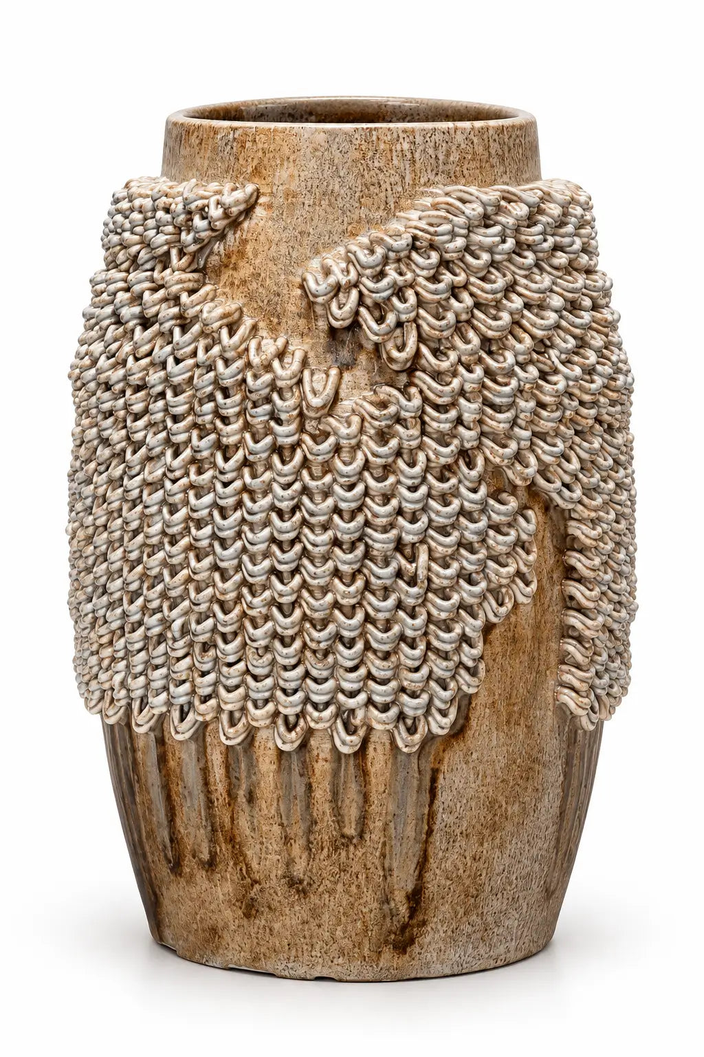 A rustic ceramic vase with a textured, ribbed brown and beige base, featuring a draped, chainmail-like metallic silver overlay on the upper half, set against a plain white background.