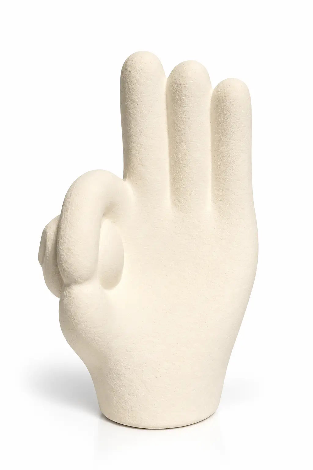 A sculptural hand-shaped object in a warm off-white or cream tone, photographed on a clean white studio background.
