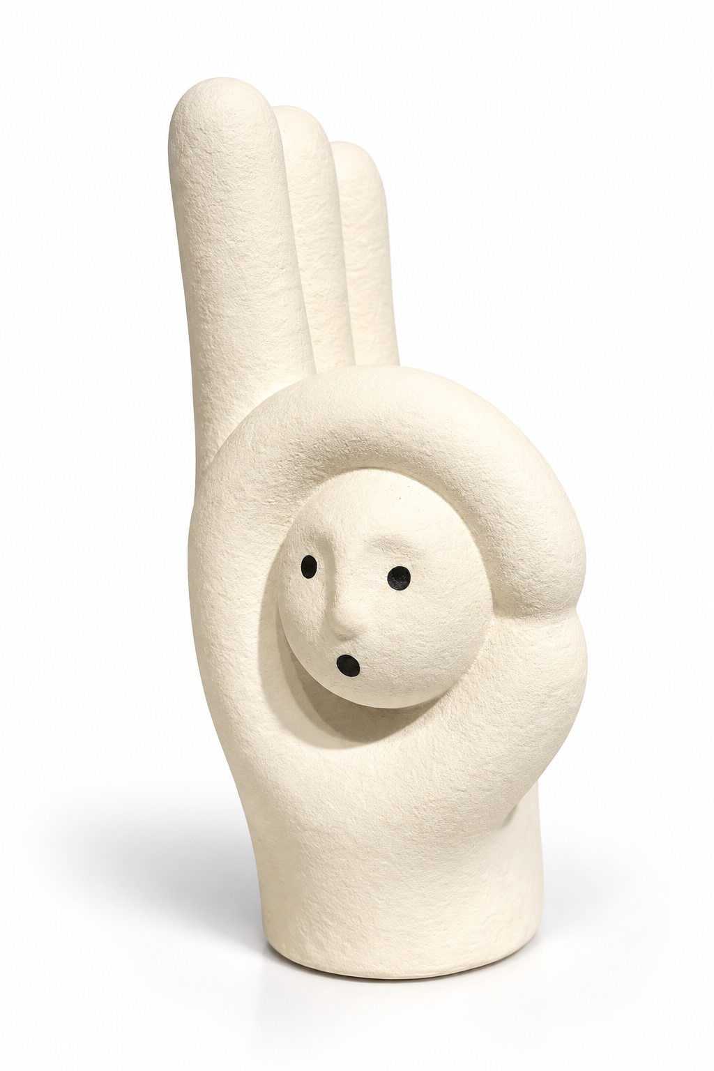 A minimalist ceramic figurine shaped like a hand making the peace sign, with a small face emerging from the palm, in a warm off-white color with small black eyes and mouth details, set against a plain white background.