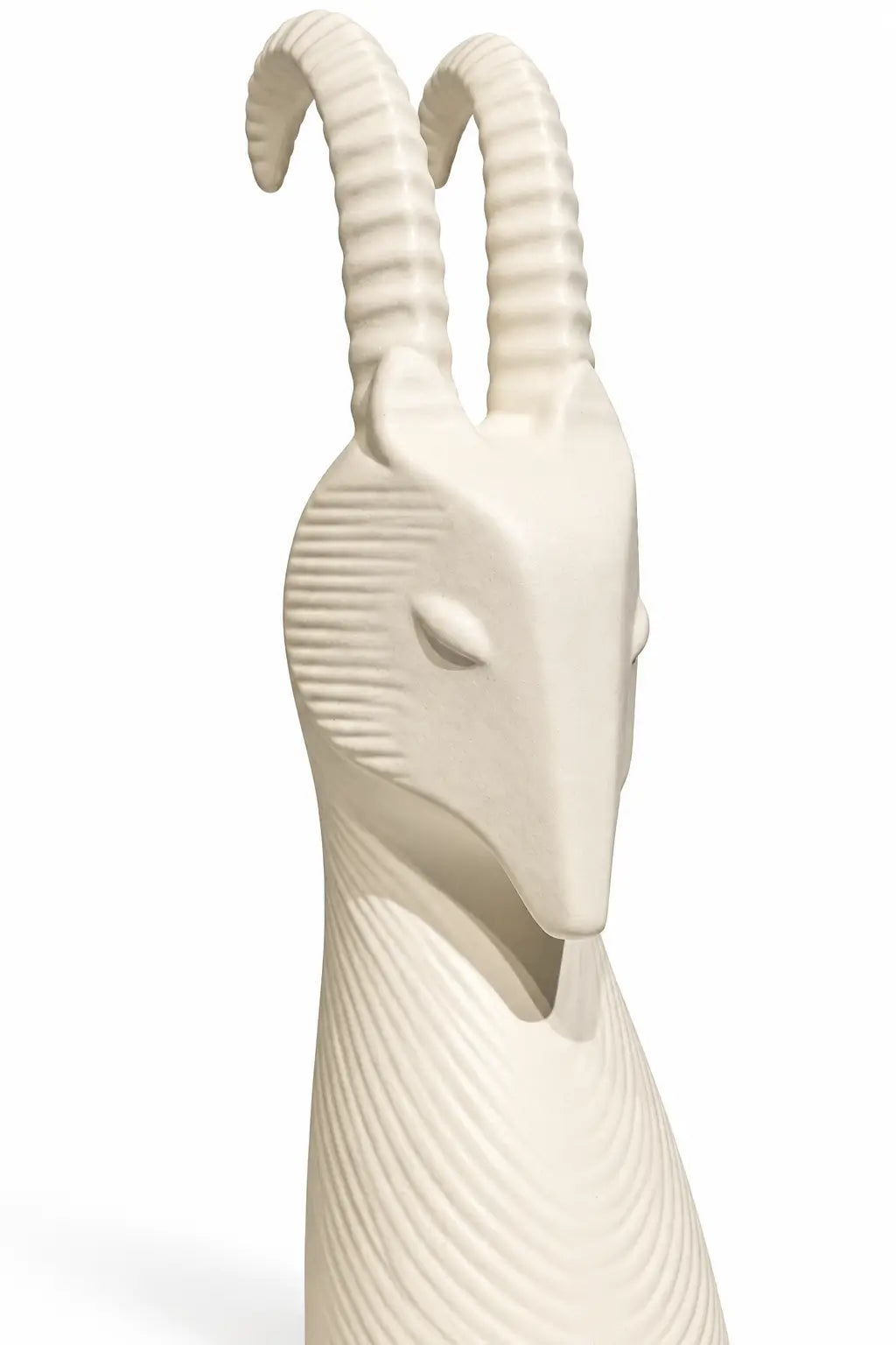 An off-white ceramic goat figurine with detailed ridges and curved horns, shown against a plain white background.
