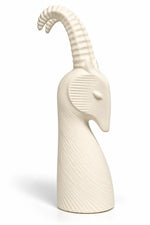 An off-white ceramic goat figurine with textured vertical ridges, shown on a clean white background.