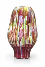 A glossy ceramic vase with an abstract dripping paint pattern in shades of burgundy, pink, green, and gold on a white background.