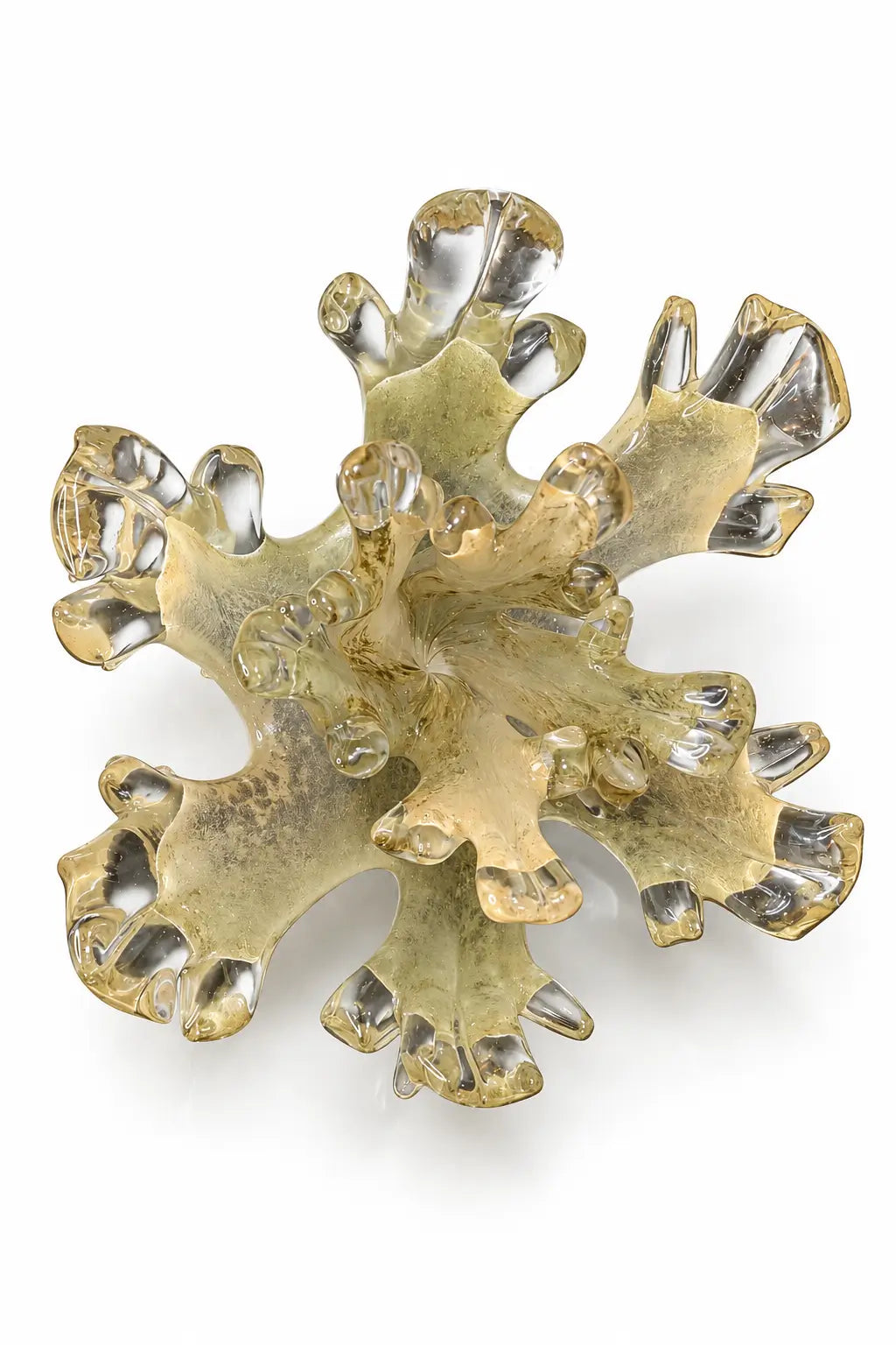 A sculptural, organic-shaped brooch or decorative piece made of layered translucent and metallic gold-toned material, photographed on a clean white background.