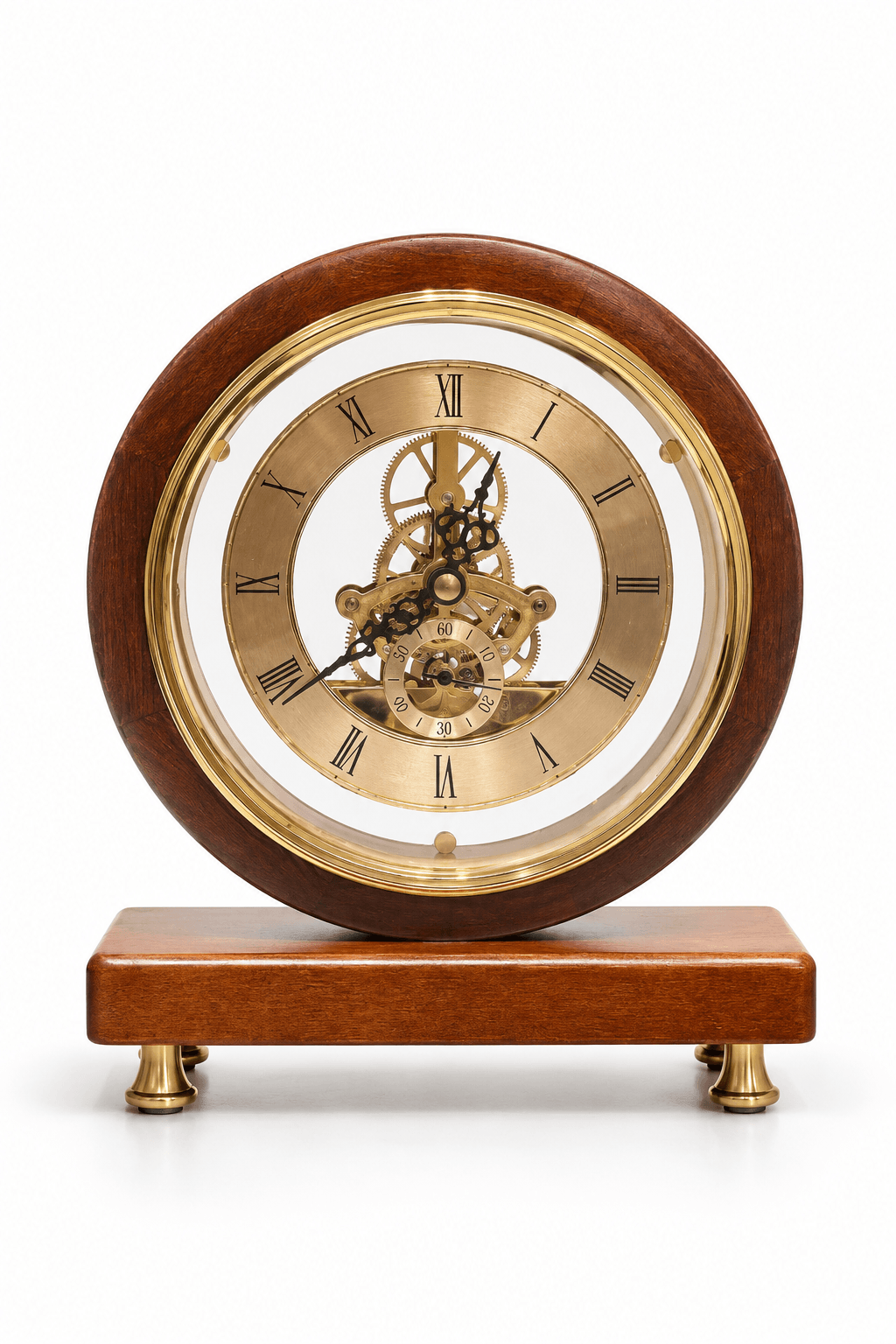 A round wooden mantel clock with a polished brown wood frame, a gold-toned brass inner ring, and a visible mechanical gear train through the center. The clock sits on a matching rectangular wooden base with small brass feet, photographed against a clean white background.