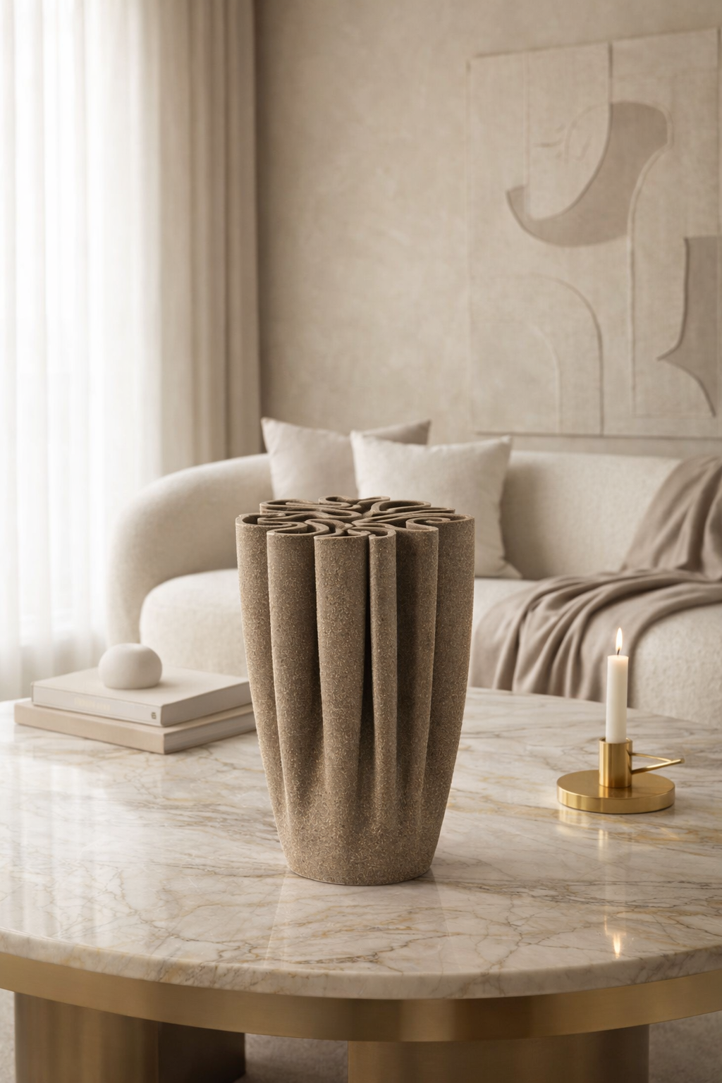 Decorative vase on a marble table with a neutral-toned living room in the background