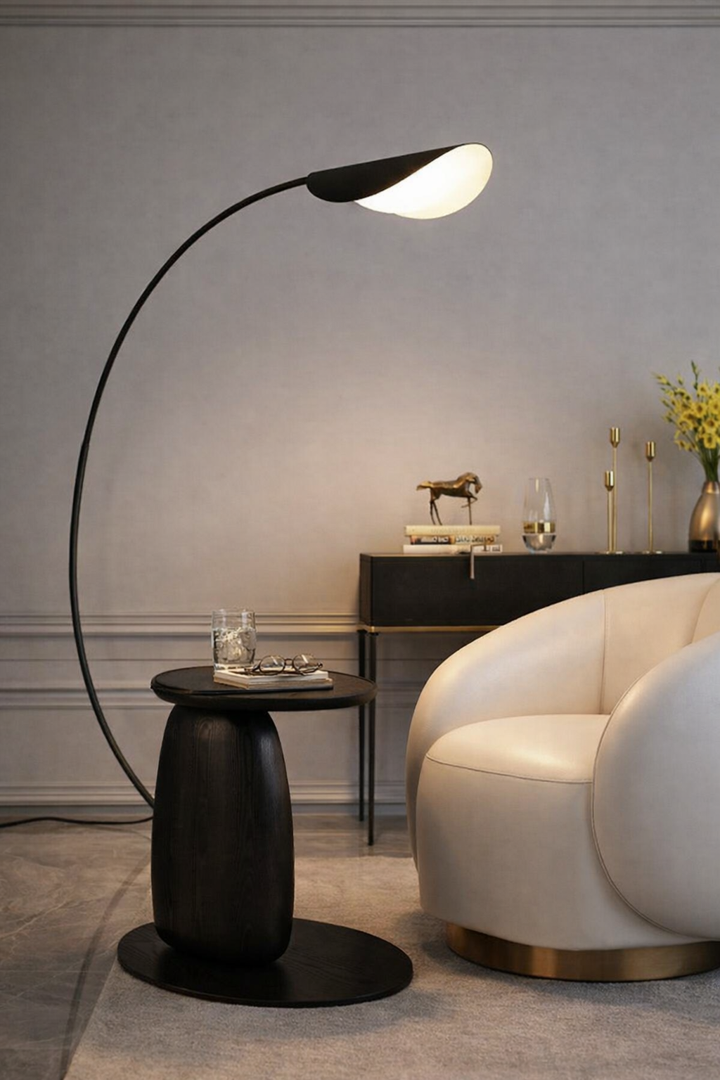 Modern living room with a black floor lamp, white armchair, and side table.