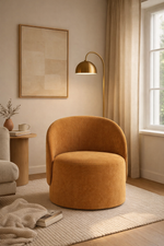 Brown chair in a cozy living room with a lamp and framed picture.