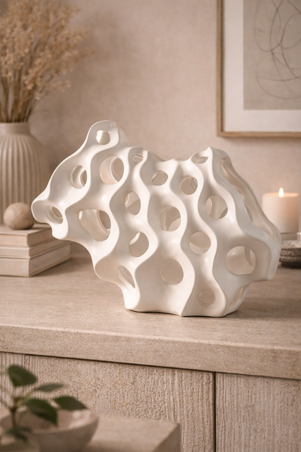 White decorative sculpture on a wooden surface with a neutral background